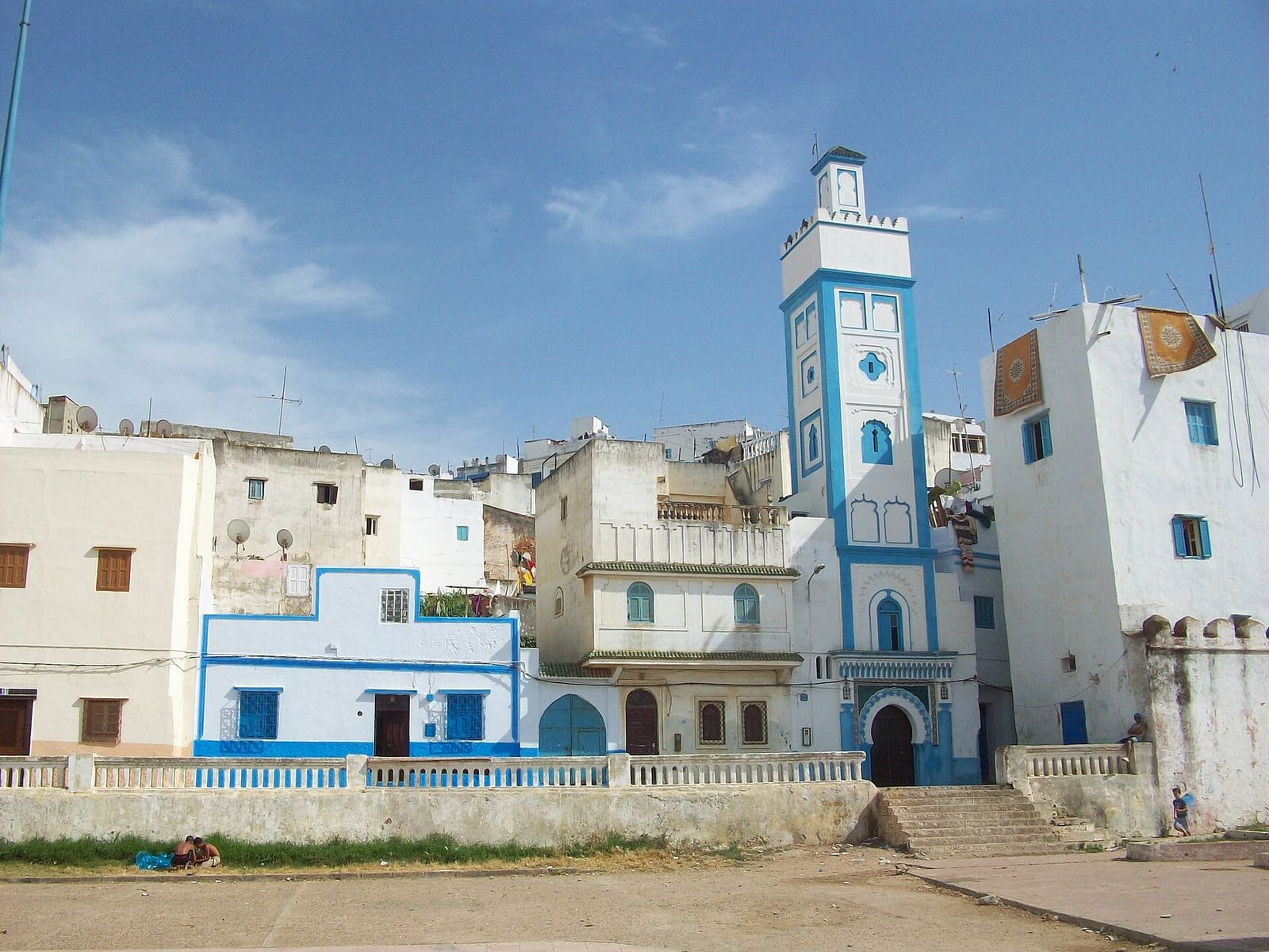 The blue and white minaret and whitewashed houses of the Larache medina