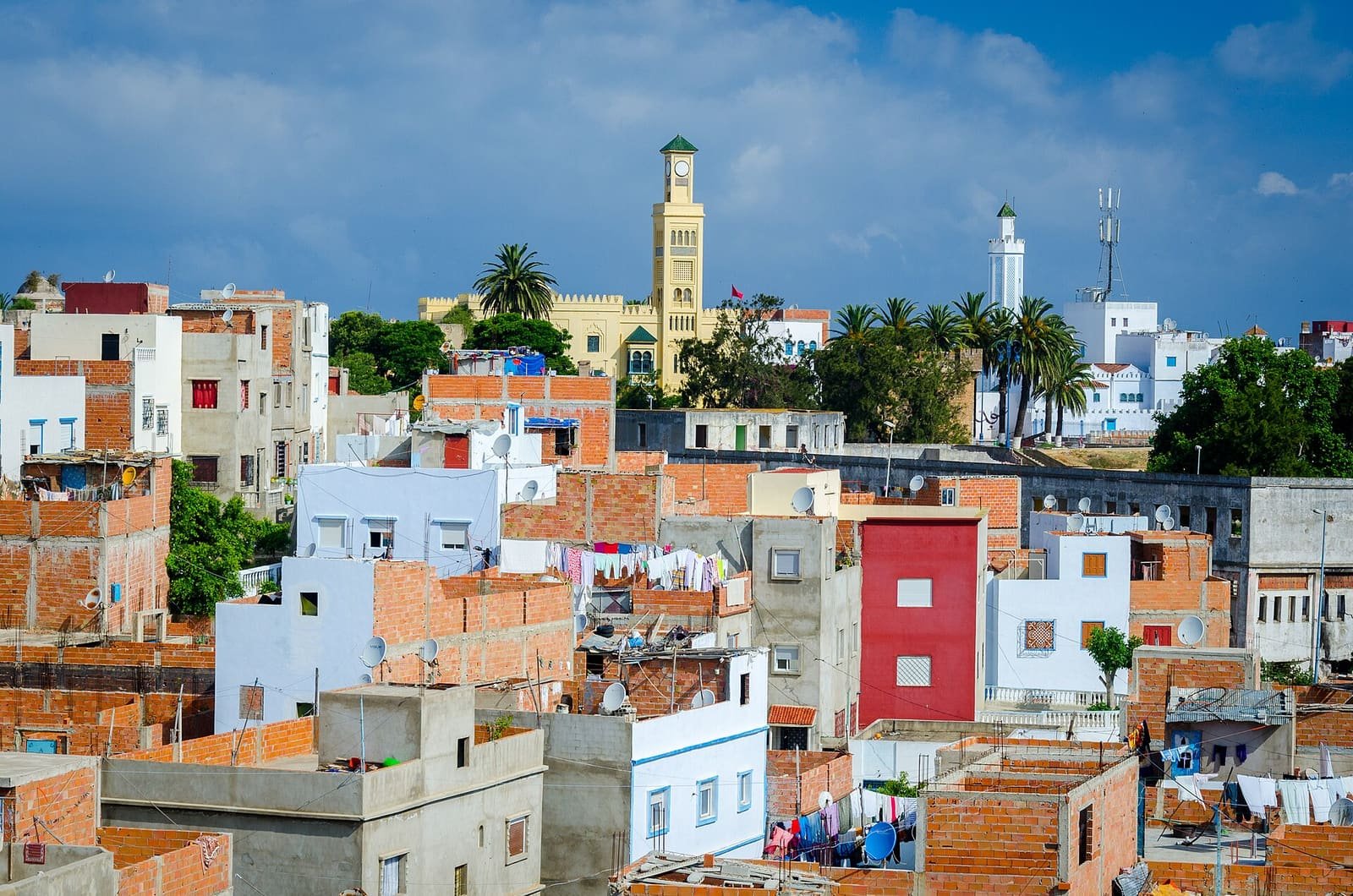Rooftops of Larache, a patchwork of white, blue and terracotta houses under a bright sky